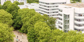 BCI building surrounded by trees